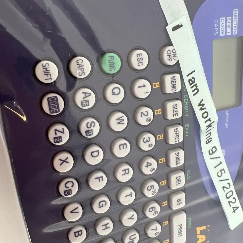 Casio LABEL IT! EZ-Label Printer Model # KL-60-L A Clear Tape Included Inside De